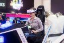 Beautiful girl on VR Racing Simulator