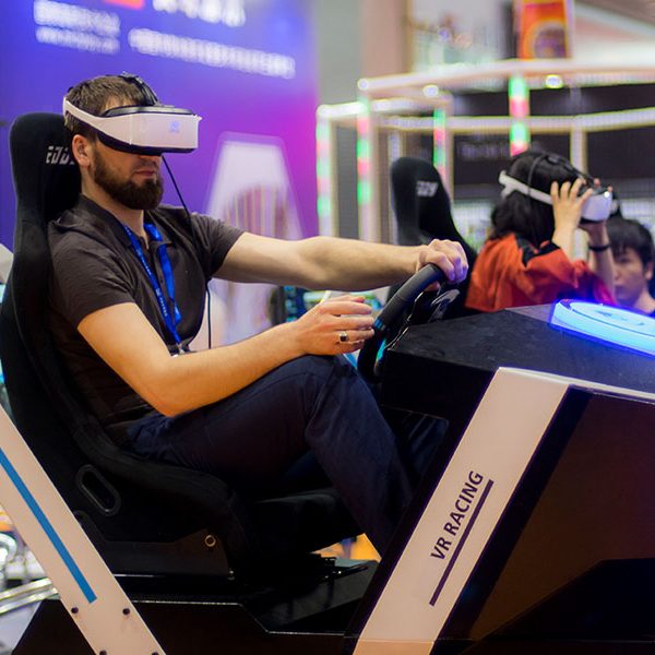 Handsome boy playing vr racing 2